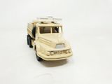 a toy truck that is sitting on a white surface