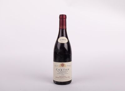 a close up of a bottle of wine on a white surface
