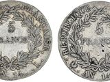 a silver coin with a wreath on the front and a laurel on the back
