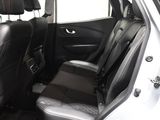 the back seats of a car are black and grey in color