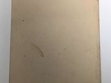 an old picture of a piece of paper on a white surface