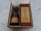 a box with a bottle of wine and a box with a label