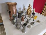 a table with a lot of silver items on it