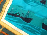 a picture of a table cloth with a picture of a boat on it