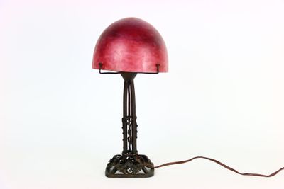 a red lamp that is sitting on a table