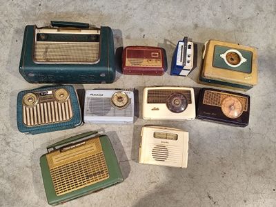 many different types of old fashioned radio ' s laid out on the floor
