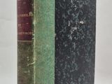 an old book sitting on top of a white table next to a white wall