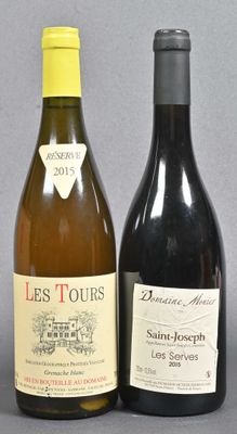 two bottles of wine sitting next to each other on a table