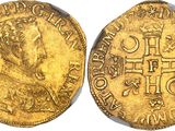 a gold coin with an image of a man on it