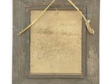 an old picture frame with a rope hanging from it ' s side