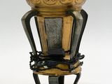 a lamp that is sitting on a stand with a lamp on it