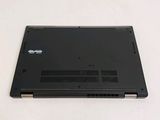 a black laptop sitting on a white surface