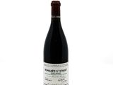 a bottle of wine that is sitting on a table