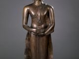 bronze statue of a seated buddha on a black base