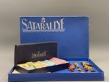 a blue box with a game set inside of it on a table
