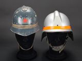 two helmets that are on display on a table
