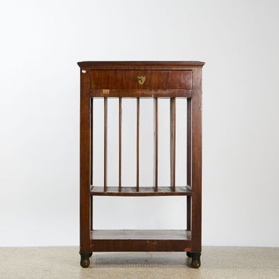 an antique wooden book shelf with a glass shelf on top