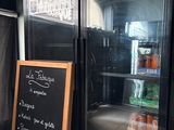 a refrigerator with a chalk board in front of it