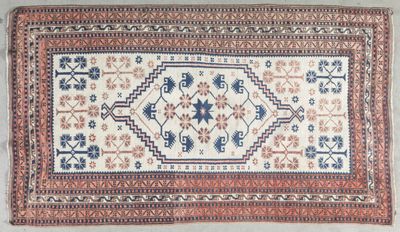 an old rug with a blue and red design on it