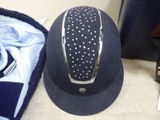 a hat that is sitting on the floor next to a towel
