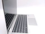 a close up of a laptop computer on a white surface