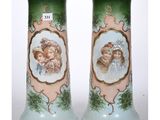 two vases with pictures of children on them sitting side by side