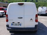 a white van that is parked in a parking lot