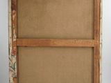 an old wooden frame with a floral pattern on it and a label on the bottom