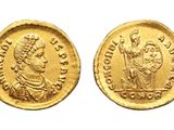 a gold coin with an image of a man on it