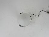 an overhead view of a light fixture with a cord attached to it