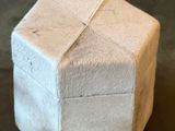 a small white box with a ribbon on it