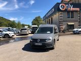the van is parked in front of the building with many cars parked in front of it