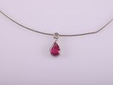a necklace with a tear shaped ruby stone on a silver chain