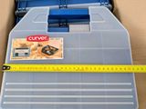 a close up of a tool box with a tape measure on it