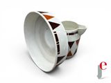 a white cup with a brown and white design on it