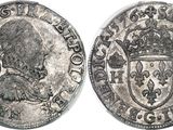 a close up of a coin with a crown on top of it