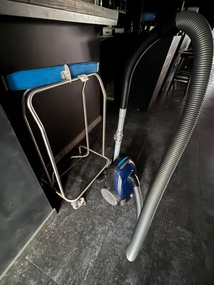 an image of a vacuum and a chair in a room