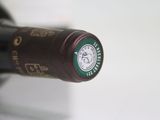 a close up of a bottle of wine on a table