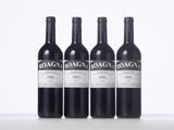 three bottles of red wine sitting on top of a white table