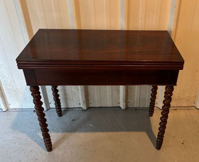 a small table with a wooden top and wooden legs