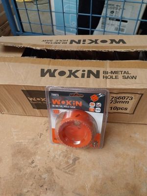 packaging of a wokin hole saw on the floor next to a box
