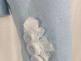 a close up of a shirt with a piece of paper on it