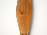 wooden fish sculpture on a wall with a white background