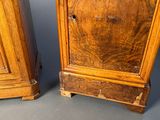 pair of antique wooden armoires with drawers on each side