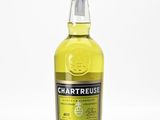 a bottle of chartreuse lemon liqueur on a white surface