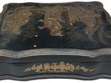 a black box with a gold design on it
