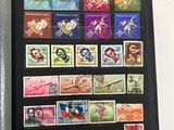 many different stamps on the cover of a book