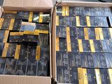 a lot of boxes of cigarettes sitting on the floor