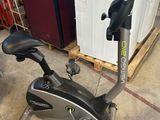 an image of a stationary exercise bike in a garage