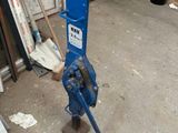 a blue machine that is sitting in the middle of a room